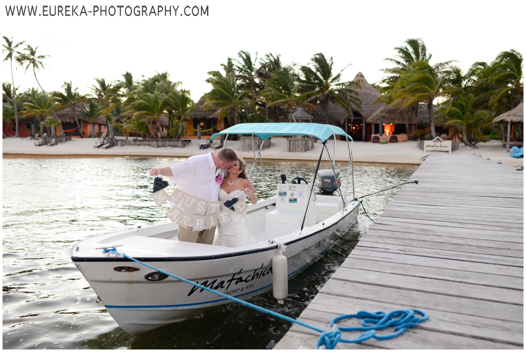 Grand exit by boat for destination beach wedding