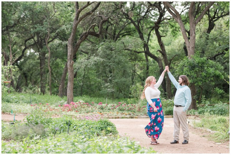bride and groom dance at Zilker botanical gardens blue dress with pink flowers 