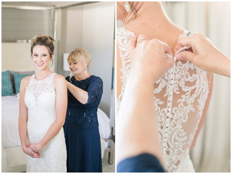 Mom buttons up bride's wedding dress in bridal suite of Stonehouse Villa 