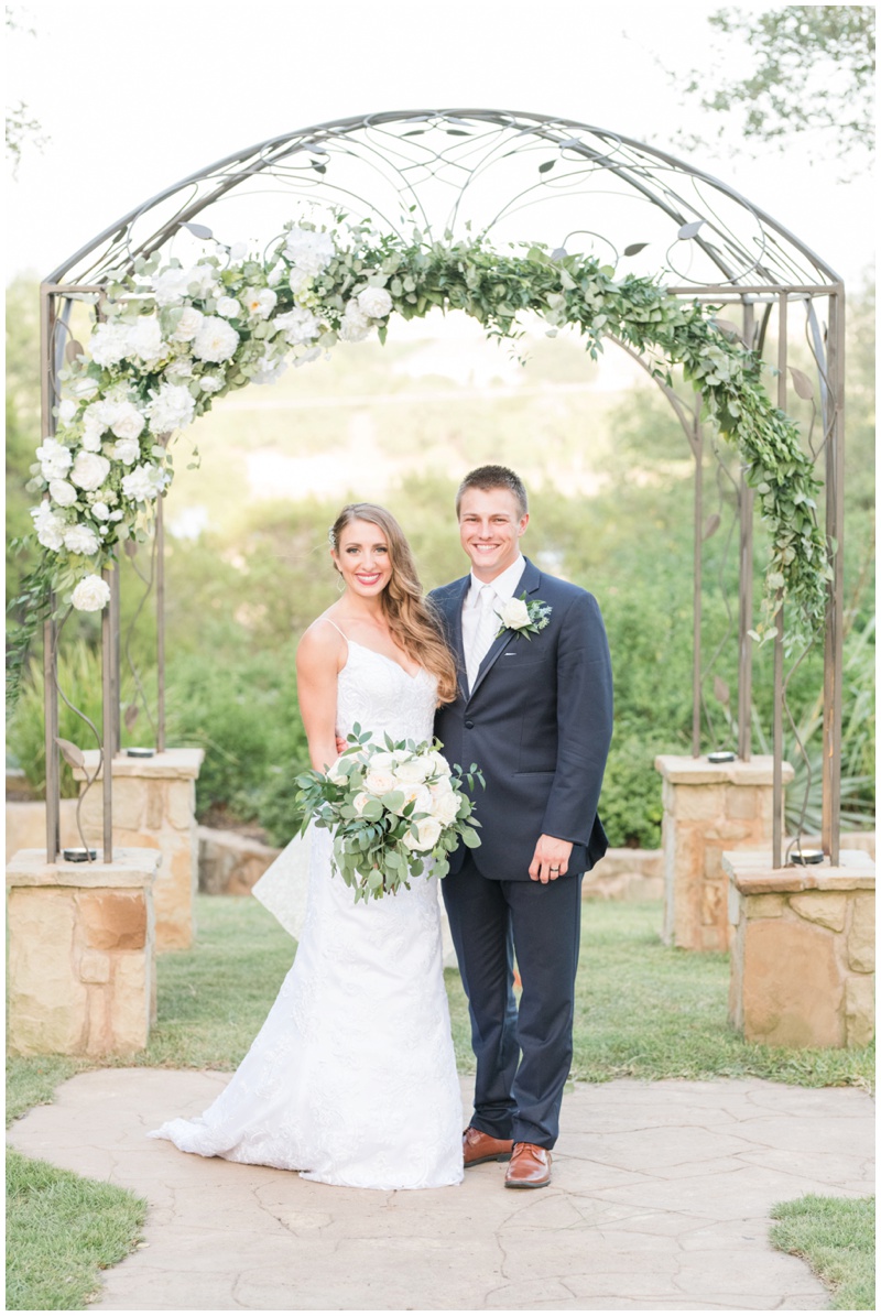 Kindred Oaks wedding ceremony arch in white and green