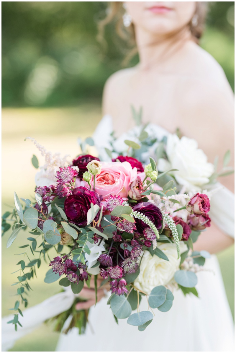 STEMS Wedding Florist in Austin Texas; Bridal bouquet in pink and cranberry at Barr Mansion Wedding