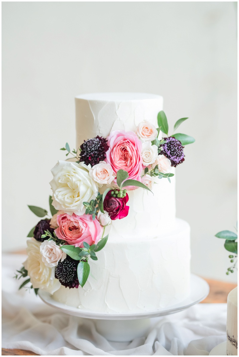Wedding cake in White with pink florals at Barr Mansion 
