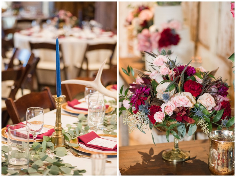 burgundy and navy wedding reception details inside Cedar Skies Barn in Burnet