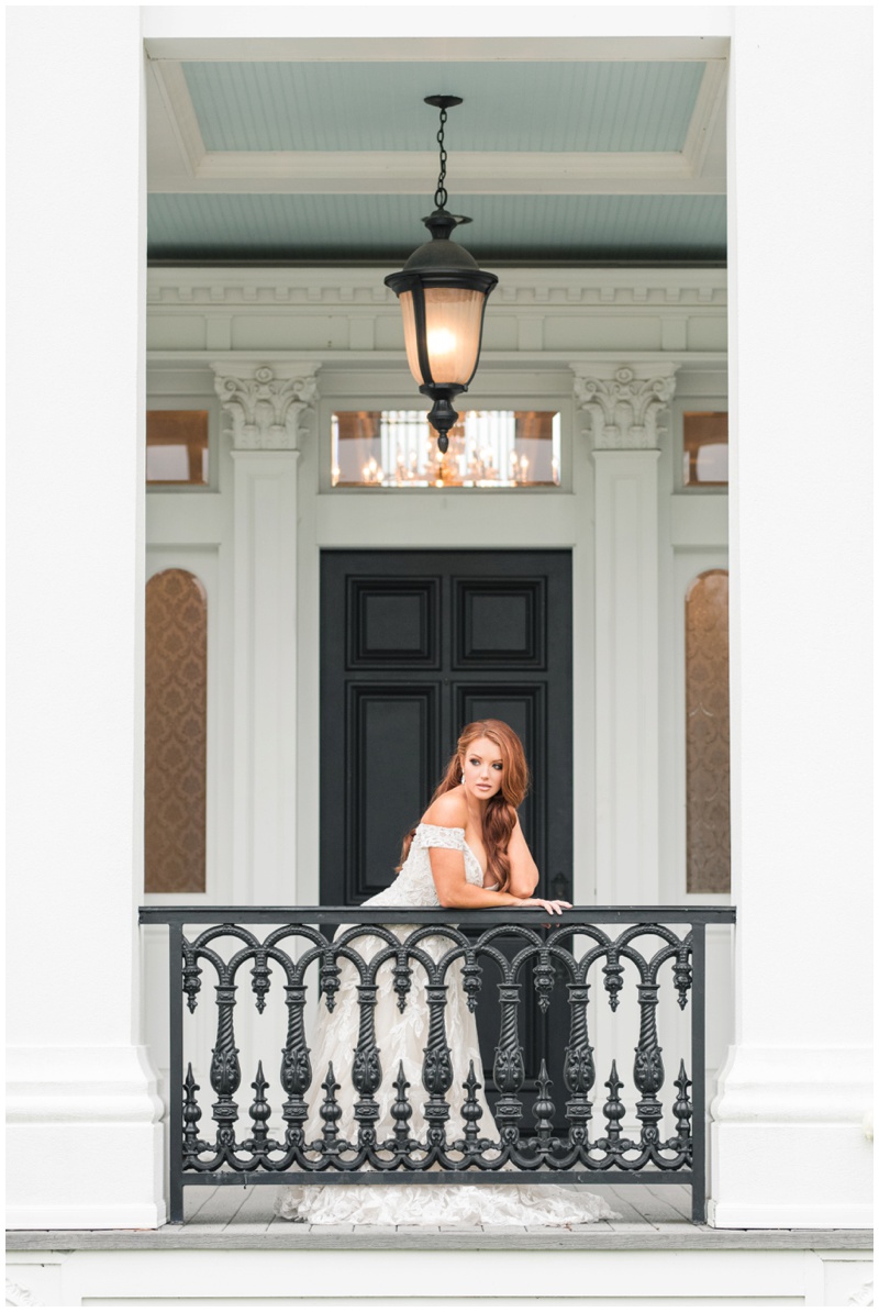 Bridal portraits on the front entry of Sandlewood Manor in Houston