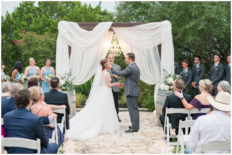 Groom wipes away tear on bride's cheek at The Terrace Club wedding Ceremony