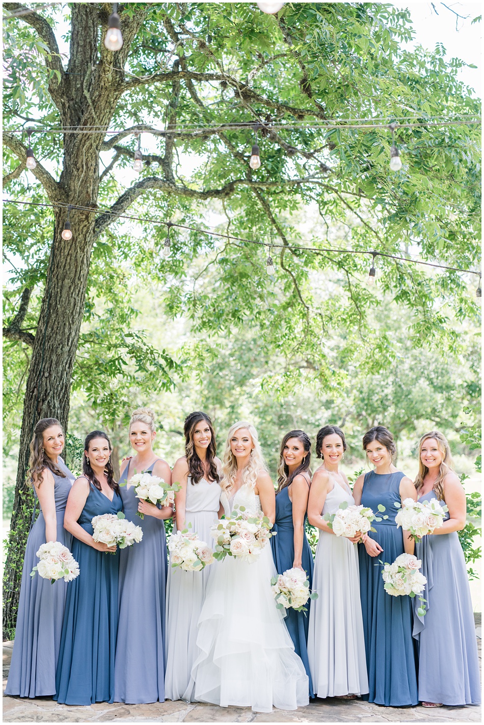 Blue Bridesmaids Dresses with white flowers for Pecan Springs Ranch Wedding
