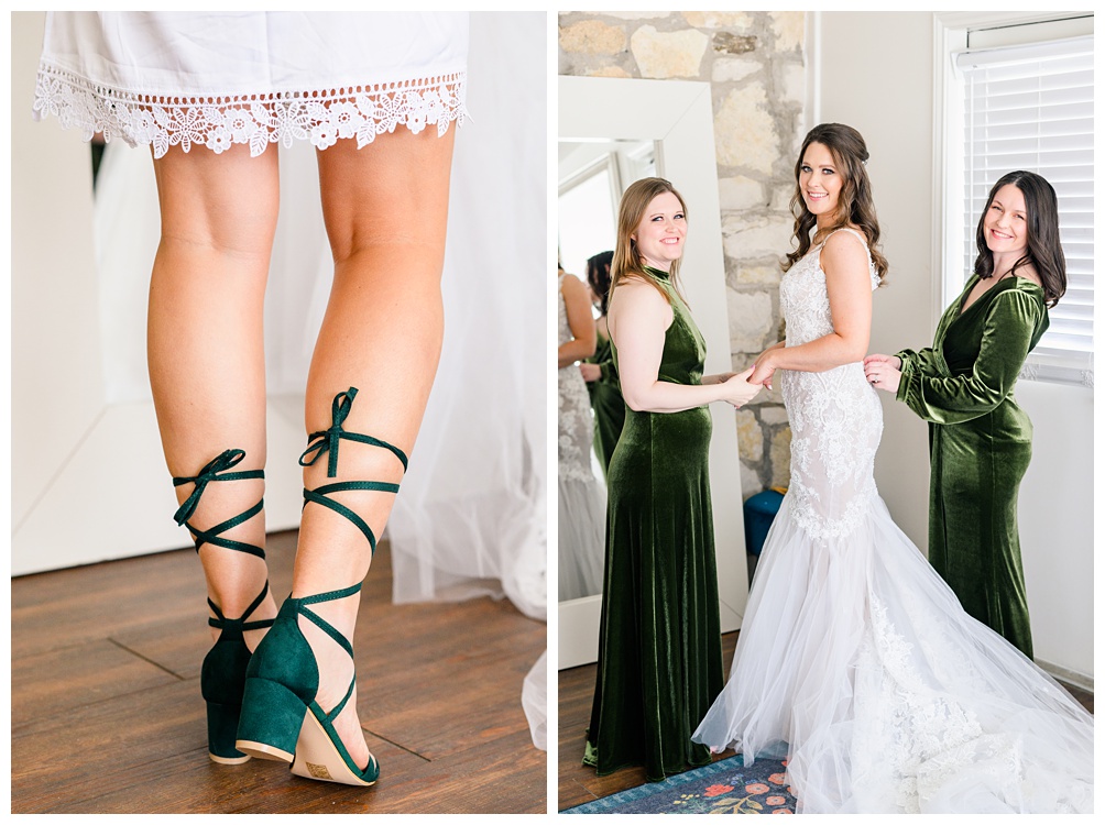Back of bridal heels that tie up the calf in hunter green paired next to bridesmaids in olive green velvet dresses helping bride get dressed at Pecan Springs Ranch in Austin, Texas