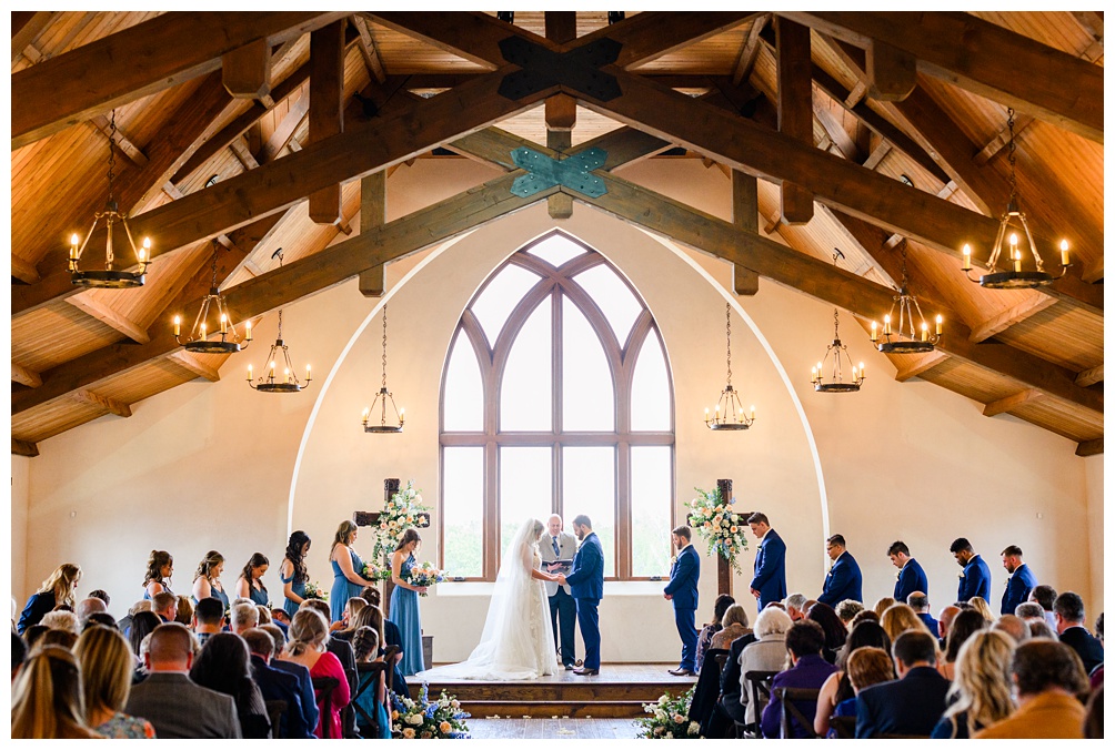 Indoor wedding ceremony at Hidden River Ranch wedding venue