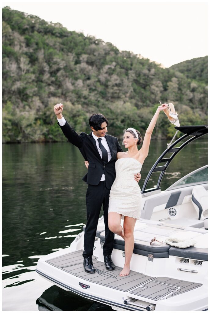 Bride and Groom exit their Lake Austin Spa and Resort wedding via a boat.