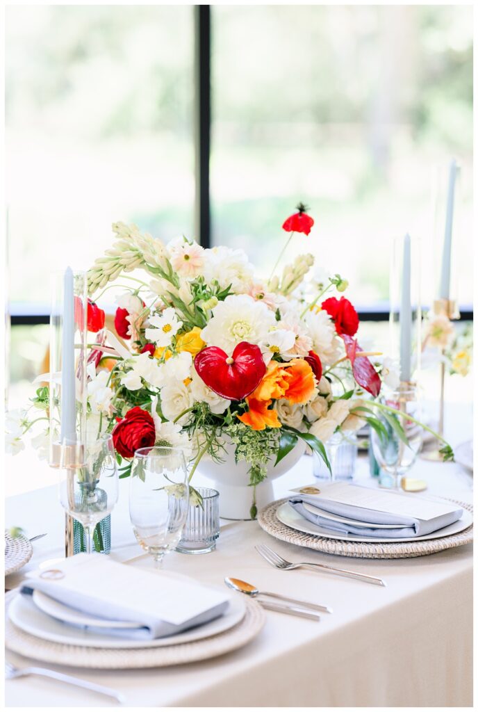 Light Blue wedding reception details with pops of bright red for a Spring wedding at The Grand Lady.